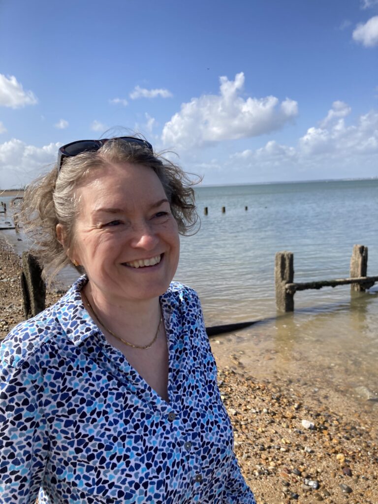 Jana standing at the sea side